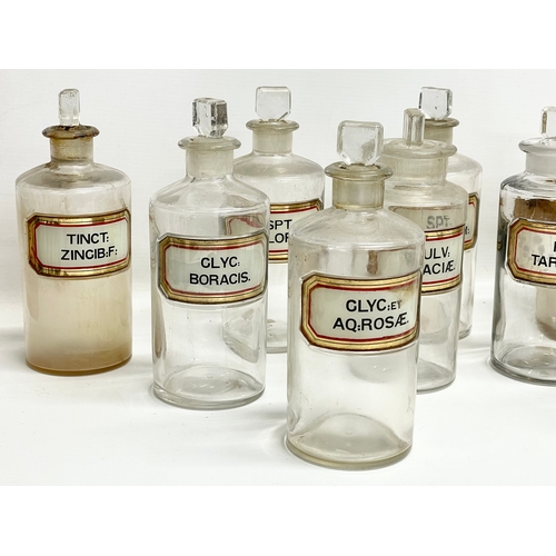 65 - 10 late 19th century chemist bottles. 20cm