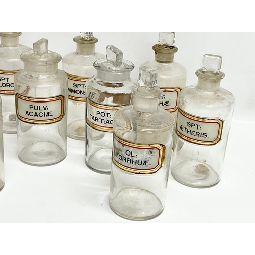 65 - 10 late 19th century chemist bottles. 20cm