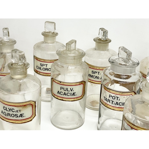 65 - 10 late 19th century chemist bottles. 20cm