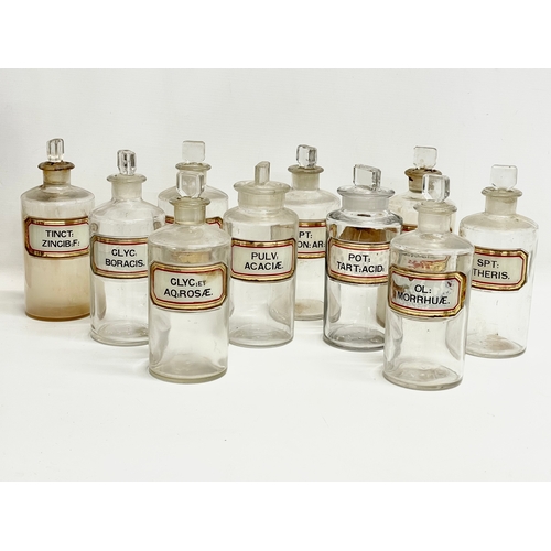 65 - 10 late 19th century chemist bottles. 20cm