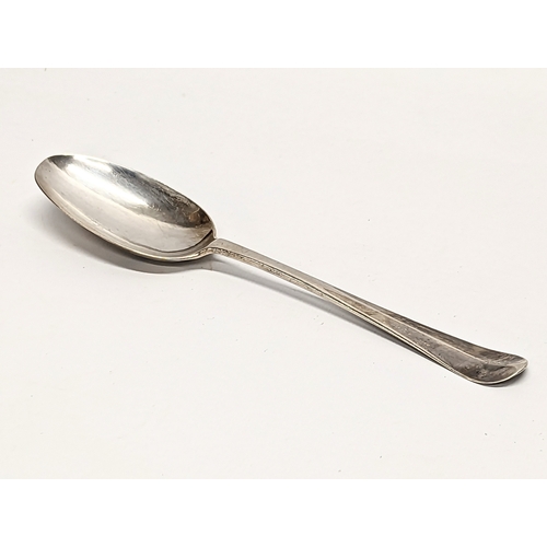 575 - A silver table spoon, London 1718.  45gms