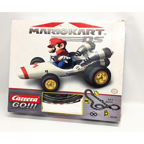 236 - A Mario Kart Slot Racing System by Carrera. Box measures 60x50cm