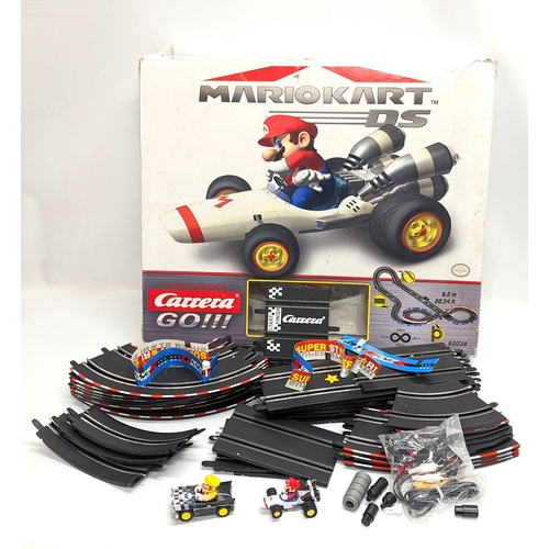 236 - A Mario Kart Slot Racing System by Carrera. Box measures 60x50cm