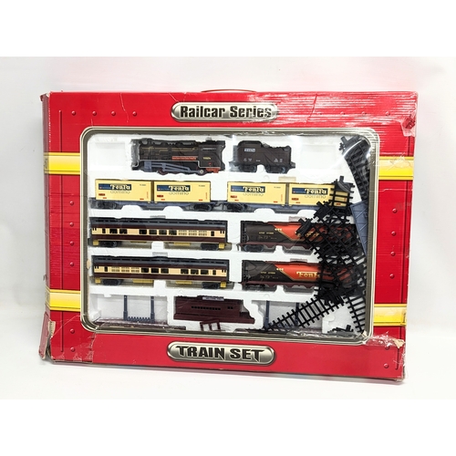 238 - A Train Set, Rail Series by Telitoy including trains, carriages and tracks.