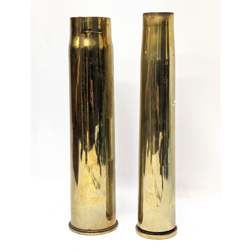 384 - A World War I brass Trench Art shell marked 1917, with World War II brass shell, marked 1942. Talles... 