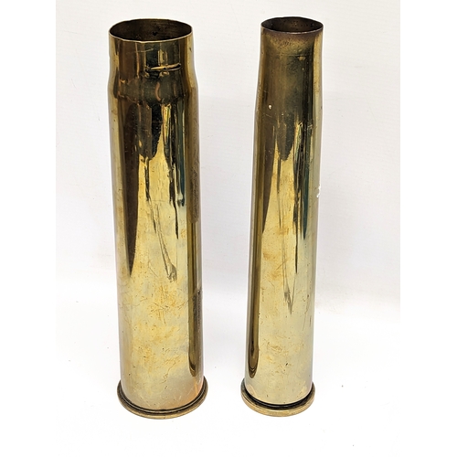 384 - A World War I brass Trench Art shell marked 1917, with World War II brass shell, marked 1942. Talles... 