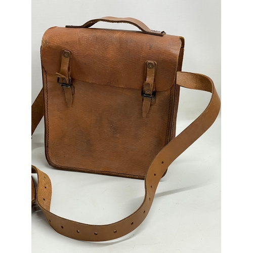 318 - 2 1940’s WW2 leather saddle bags. 25x32cm.