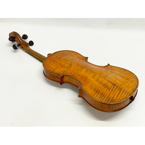 320 - A good quality late 19th/early 20th century violin in case. Case measures 79cm