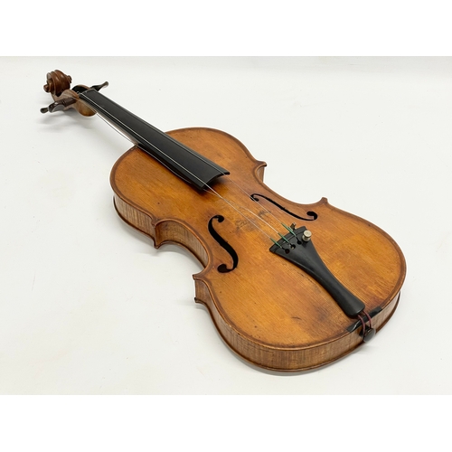 320 - A good quality late 19th/early 20th century violin in case. Case measures 79cm