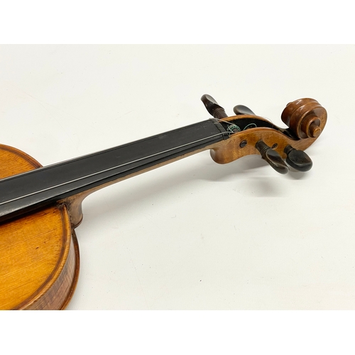 320 - A good quality late 19th/early 20th century violin in case. Case measures 79cm