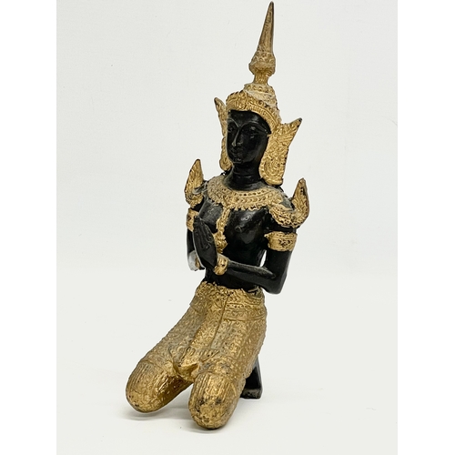 409 - An early 20th century gilt bronze Deity figure. 22cm