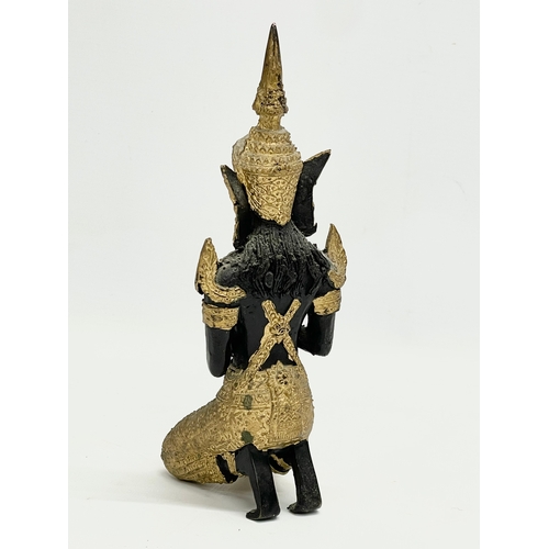 409 - An early 20th century gilt bronze Deity figure. 22cm