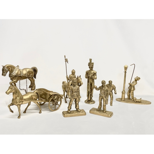 473 - A quantity of large heavy brass ornaments. Horse and cart measures 33cm. Knight on horse measures 21... 