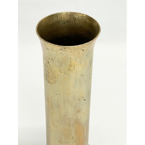 386 - A brass cannon shell. 10x22cm