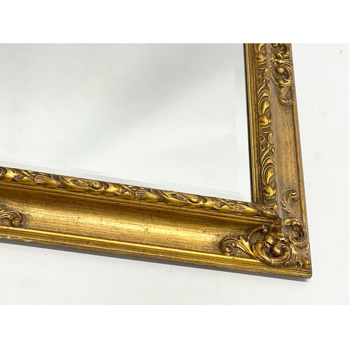 410 - A good quality vintage ornate gilt framed mirror. 72.5x57.5cm