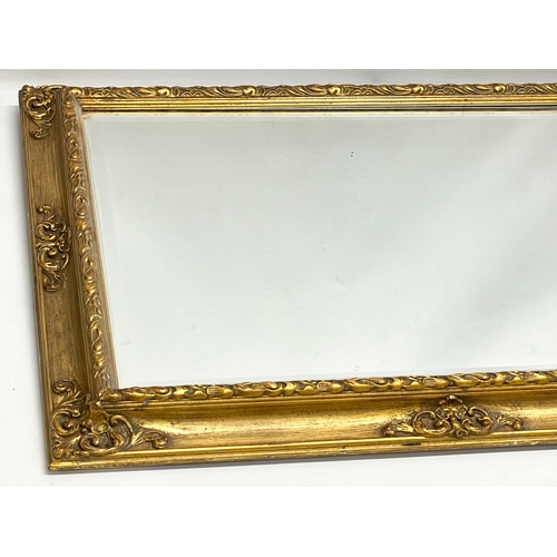 410 - A good quality vintage ornate gilt framed mirror. 72.5x57.5cm