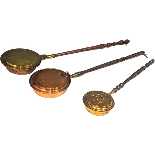 478 - 2 early 20th century copper and brass bed warmers, with other. Largest measures 118cm