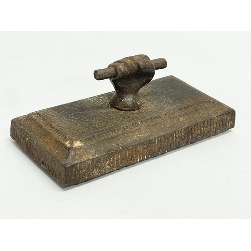 429 - A Victorian cast iron clinch paperweight. 11cm.