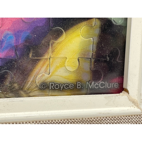 671 - A vintage Royce. B. McClure framed puzzle picture. 56x46cm.