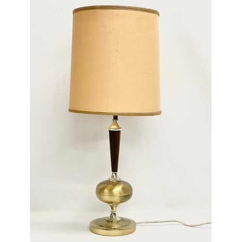 672 - A tall 1960’s Mid Century brass and rosewood table lamp. 73cm