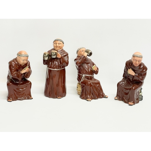 433 - A set of 4 vintage pottery gambling monks by Bretby. 21cm