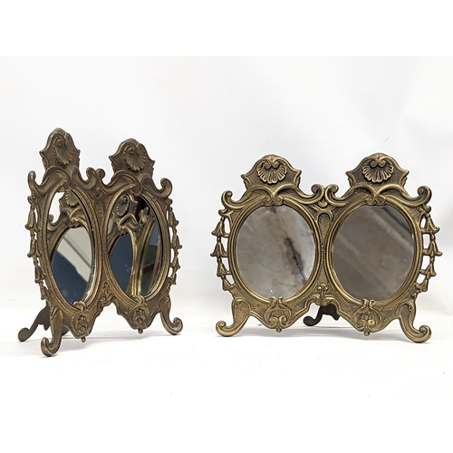 484 - A pair of ornate brass mirrors. 21x19.5cm