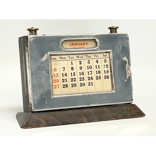 576 - An Art Deco silver desktop calendar. 15x10cm