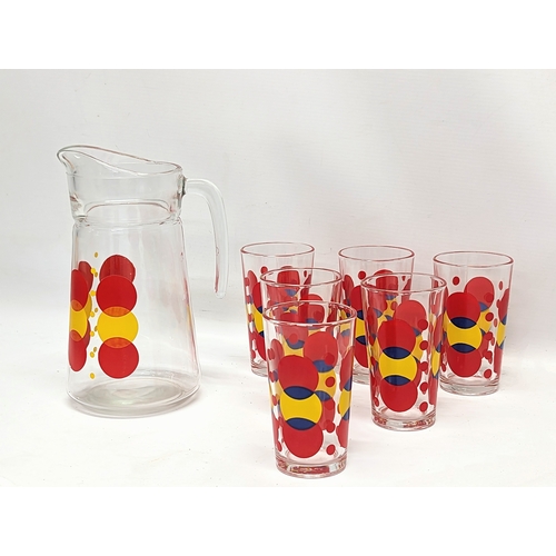 647 - A 1960s Mid Century glass drinking set. Jug measures 22cm