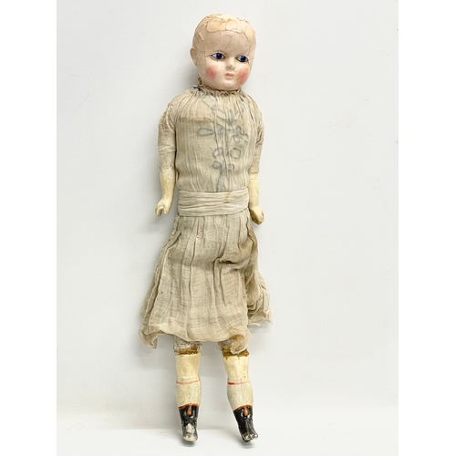 440 - A large late 19th/early 20th century doll with plaster face and arms. 59cm