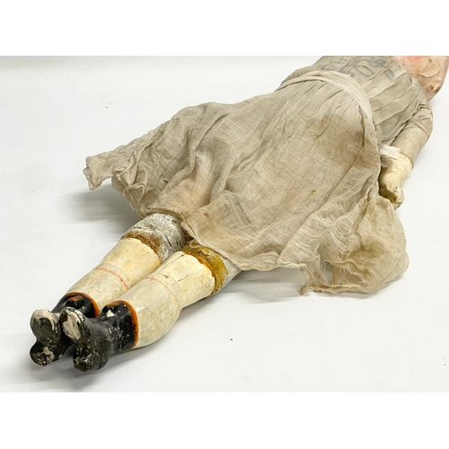 440 - A large late 19th/early 20th century doll with plaster face and arms. 59cm