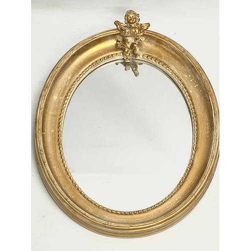 491 - An ornate gilt framed mirror. 41x53cm