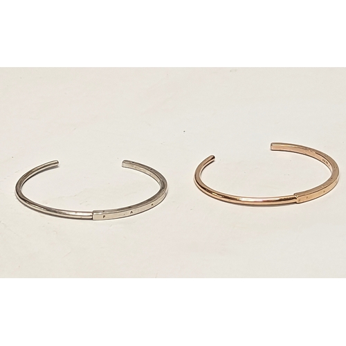 577 - A silver bangle with other bangle.