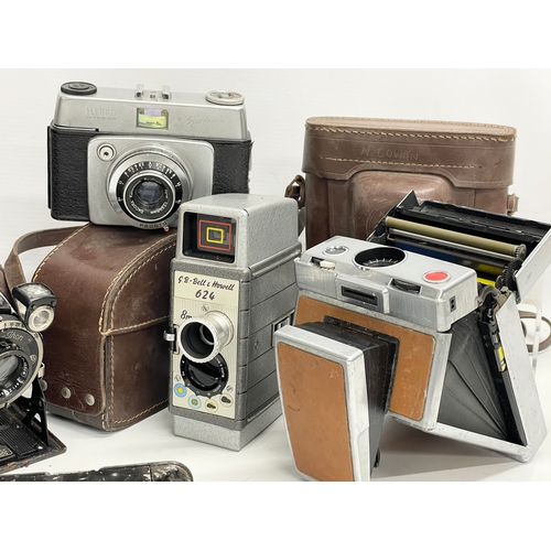 252 - A collection of vintage cameras.