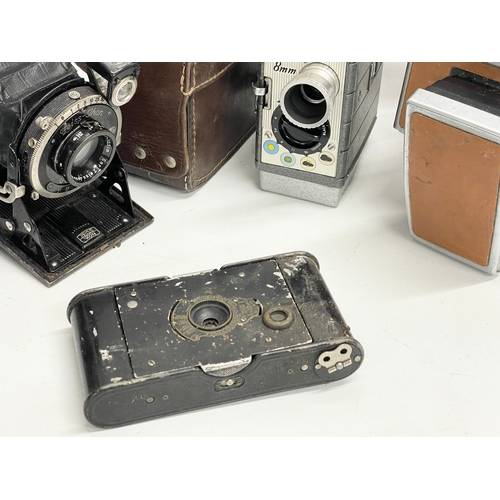 252 - A collection of vintage cameras.