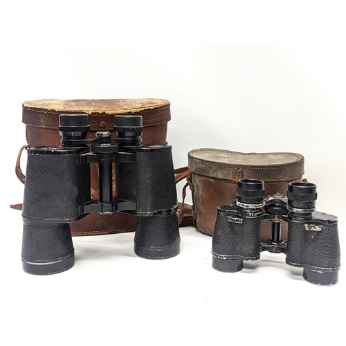 390 - 2 pairs of vintage binoculars in cases