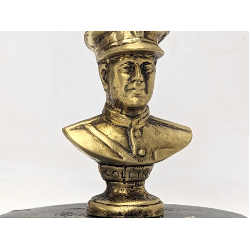 642 - A vintage miniature brass bust of Michael Collins. 11cm