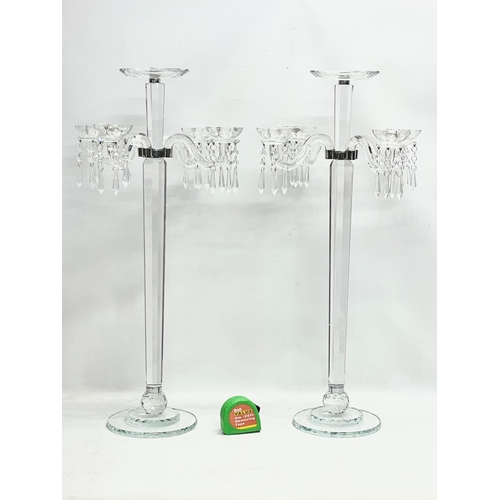 435 - A pair of large ornate glass candelabrums. 33x78.5cm