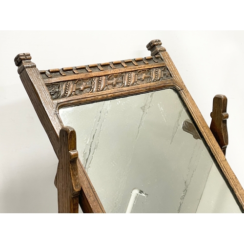 500 - A large early 20th century carved oak tabletop dressing mirror. 56x21x73cm