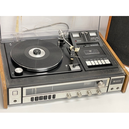 257 - A vintage Sanyo G2711-Super music record cassette player with a pair of teak Wharfedale speakers.