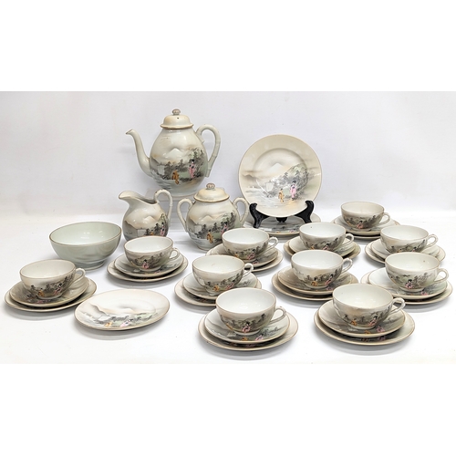 636 - A 40 pieces Japanese pottery tea set.