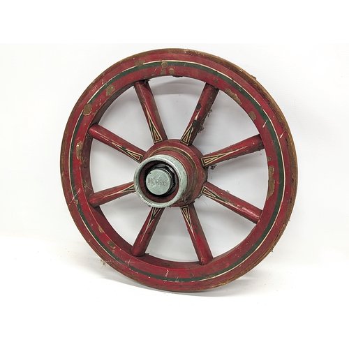 454 - A small vintage cart wheel. 45cm