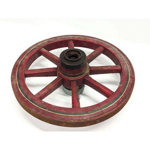 454 - A small vintage cart wheel. 45cm