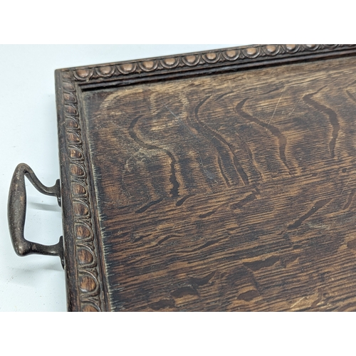 509 - An early 20th century oak serving tray. 57.5x36cm