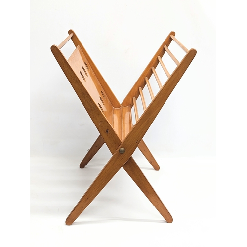 834 - A Mid Century magazine rack designed by Niko Kralj for Stol Kamnik. 45x49cm