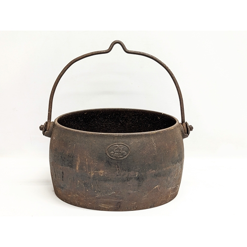 687 - A Victorian cast iron pot. 37x38cm