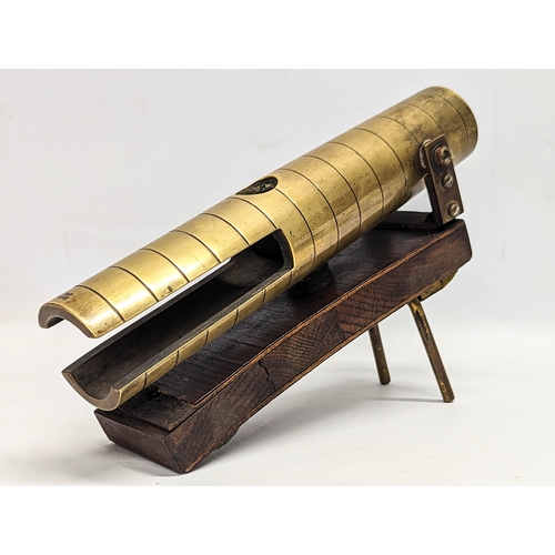 617 - A late 19th / early 20th century musical instrument, engraved J. C. Deagan, Chicago. 25x17cm