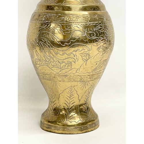 517 - A late 19th century Chinese brass vase. 35cm