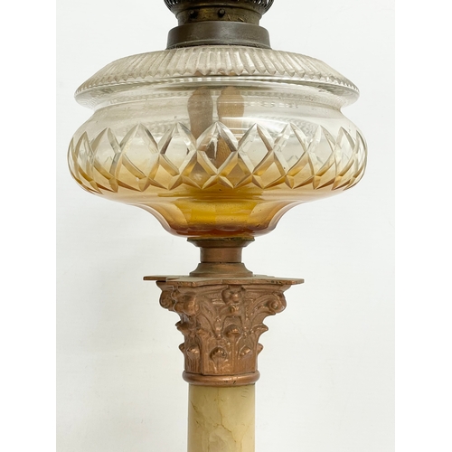 518 - A large Victorian onyx and brass oil lamp with Corinthian style pillar. 56cm