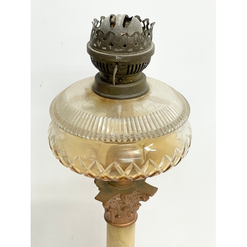 518 - A large Victorian onyx and brass oil lamp with Corinthian style pillar. 56cm