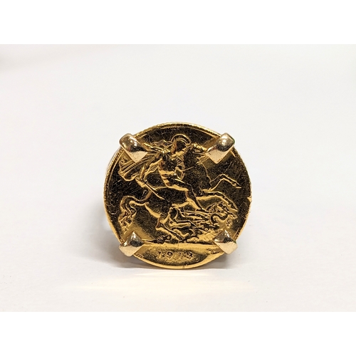 578 - A 9ct gold ring with a Half Sovereign. 7.5g. Size UK R.